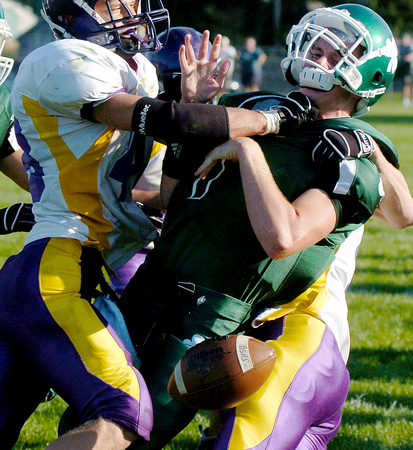 Don Campbell / H-P staff
Berrien Springs' Jeremy Dybdahl (7) is hit hard by Kalamazoo Christian's Ryan Niewoonder (48) during the third quarter Saturday August 25, 2007, at Berrien Springs High School