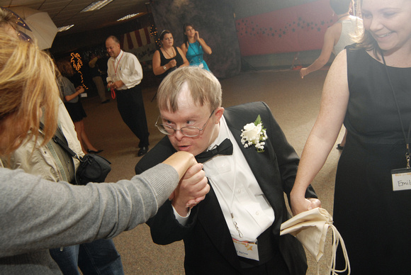 Don Campbell / H-P staff
Rick Barlow, center, from St. Joseph, kisses the hand of Lynne Reuter, left from St. Joseph, during the start of "The Prom, An Evening With The Stars," held Saturday, October