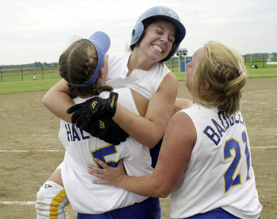 Don Campbell / H-P staff
LMC's Elizabeth Allen (13) center celebrates with Johnelle Halteman (5) and Amber Badgley (21) after hitting two runners in, on a double, to take a 4-2 lead over Burr Oak, Tue