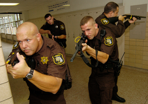 Don Campbell / H-P staff
From left to right, Berrien County Sheriff deputies John Hopkins, Mike Moore, back, Justin Hopkins, center, and Roger Johnson, far right, run through tactical response drills