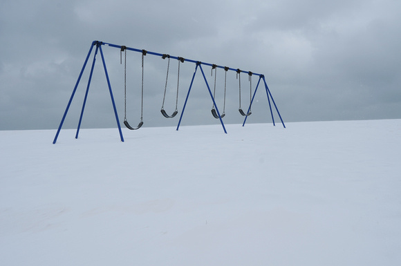 A blanket of snow buries a swingset along Lake Michigan in St. Joseph.