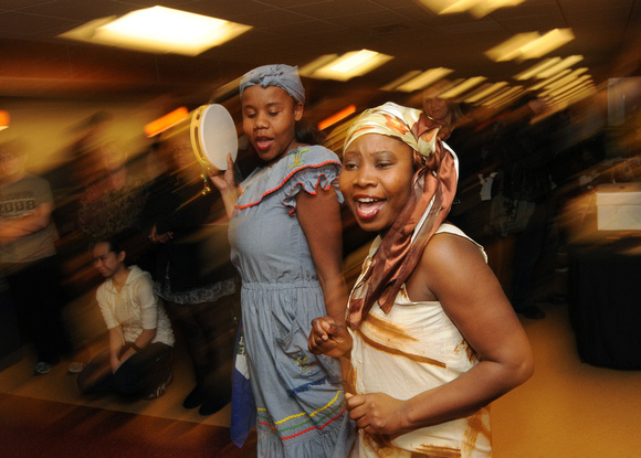 Don Campbell / H-P staff
Lake Michigan College students Farah Nelson, left, and Guerline Gilles, right, both from Haiti, dance Thursday, November 17, 2011, in celebration of International Education We