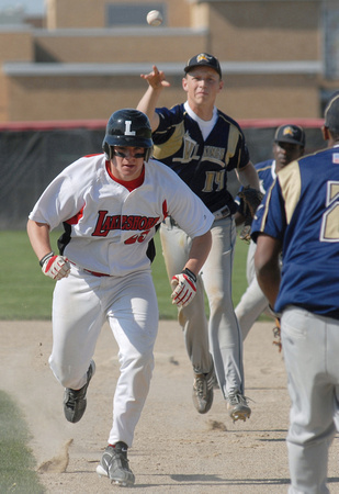 Don Campbell / H-P staff
Lakeshore's Brett Buckley is caught in a rundown between first and second by Niles' Andrew Brawley (14) and Aaron Davis (2) during the fifth inning of the first game of a doub
