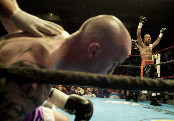 Don Campbell / H-P staff
Courtney Burton, right, from Benton Harbor, celebrates his win by a knockout over Angel Manfredy, Tuesday night at the Civic Center in Hammond, IN.