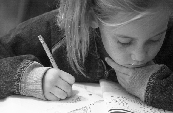 Don Campbell/H-P staff
Eight-year-old Kaitlin Farrell, focuses on her schoolwork, Wednesday morning at Wood School, in Bangor Township. Farrell, a third grade student from South Haven is one of 15 stu