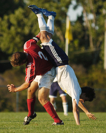 Don Campbell / H-P staff
St. Joseph's Andrew Haumersen (9) gets tangled with Holland's Jeff Dalman (2) during the first half Tuesday, September 4, 2007, at Upton Middle School.