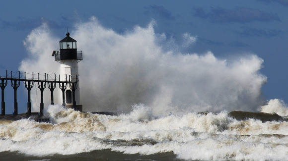 Waves crash into the outer light of the St. Joseph Lighthouse October 15, 2011.