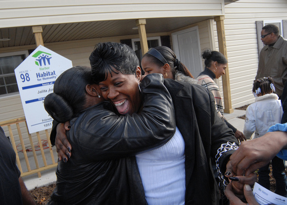 Don Campbell / H-P staff
Jalita Joseph celebrates with family and friends after receiving the keys to her new Harbor Habitat for Humanity home Saturday, November 21, 2009, in the Crystal Estates subdi