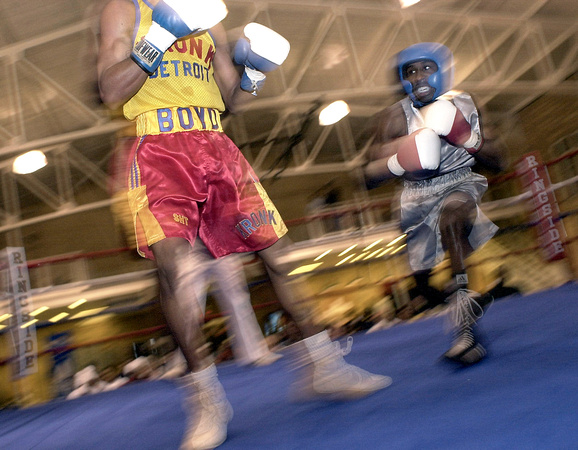 Terry Gladden, right, of Ohio, battles Fletcher Boyd, of Detroit, during their 119-pound weight class bout Friday night at the 2001 Great Lakes Region Championships held at the Bobo Brazil Community C