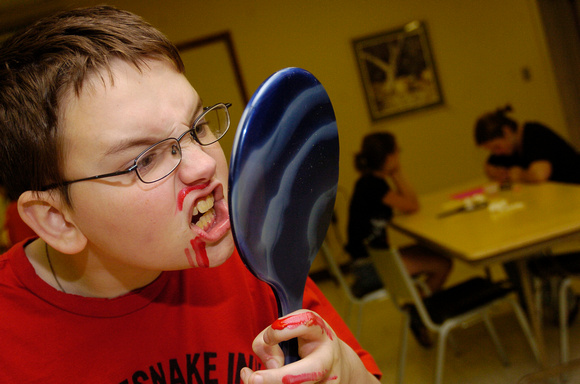 Don Campbell / H-P staff
Twelve-year-old Duane Horton, from St. Joseph, admires his handiwork during a "Monster Make-Up" class Tuesday, June 20, 2006, at the St. Joseph Public Library.
