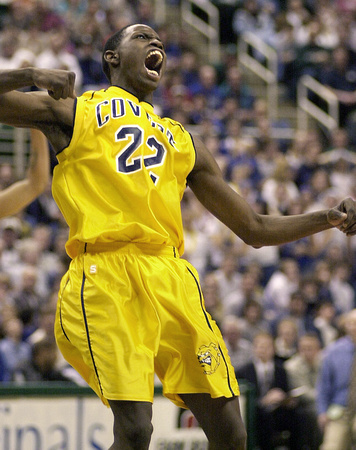 Covert's Earl Jackson celebrates after making a three point basket to push the game into double overtime during a semi-final match-up against Fowler at the Breslin Center in East Lansing, MI.
