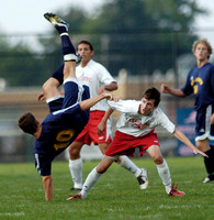 Don Campbell / H-P staff
St. Joseph's Christopher Teich (10) hits the ground hard after going for a ball against Lakeshore's Hunter Hendley (3) during the first half Thursday, September 14, 2006, at L
