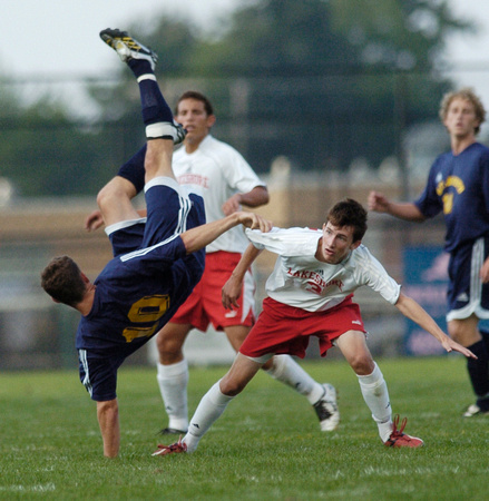 Don Campbell / H-P staff
St. Joseph's Christopher Teich (10) hits the ground hard after going for a ball against Lakeshore's Hunter Hendley (3) during the first half Thursday, September 14, 2006, at L