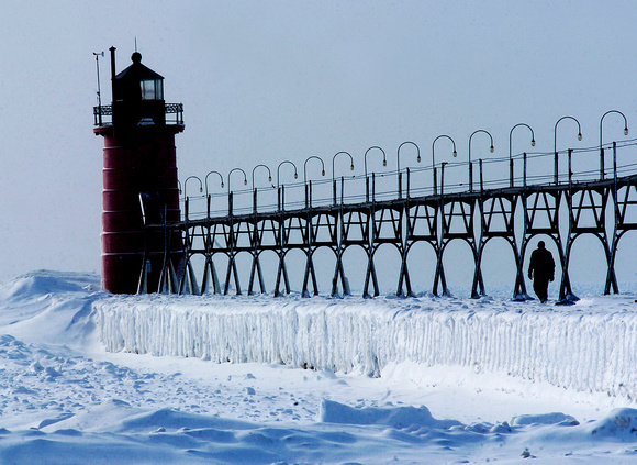 Don Campbell / H-P staff
A lone walker makes his way down to the South Haven Lighthouse Tuesday, February 6, 2007.