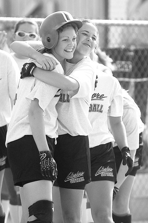 H-P photo by Don Campbell
Lakeshore's Emily Zangaro, right, hugs Melissa Brink as the Lancers celebrate a 1-0 win over Edwardsburg during the first game of Wednesday's double header at Lakeshore High