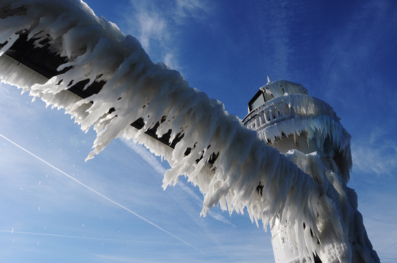 Ice melts on the outer light of the St. Joseph Lighthouse Thursday, January 5, 2012.