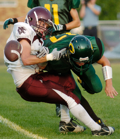 Don Campbell / H-P Staff
Watervliet's Corey Barker is hit hard by Coloma's Huston Harrison during the first half Thursday, August 28, 2008, at Coloma High School. Barker was ruled to have been hit aft