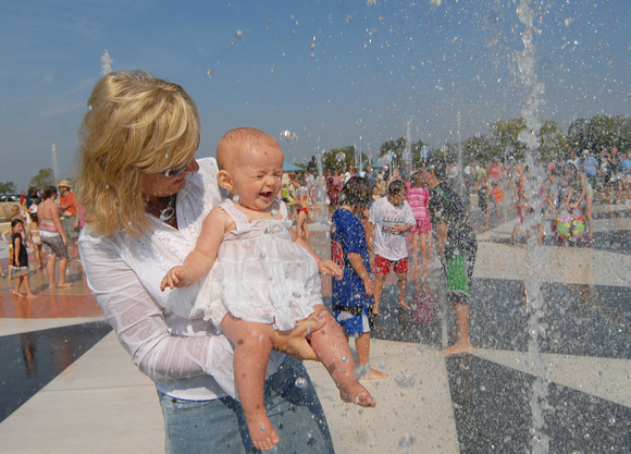 Don Campbell / H-P staff
Gail Lueth and her granddaughter, eight-month-old Maizie Dail, from St. Joseph, get drenched in the Whirlpool Compass Fountain, located below the bluff in St. Joseph. The gran