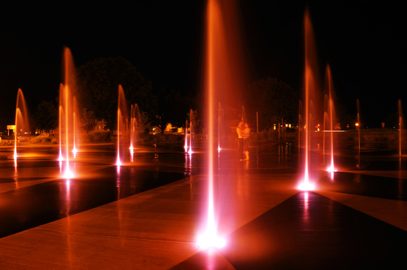 A couple share a quiet moment during a summer evening at the Whirlpool fountain in St. Joseph, Mich. 2011