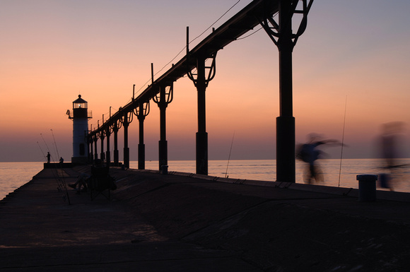 The sun sets on the North Pier in St. Joseph, Mich., Friday, August 19, 2011.