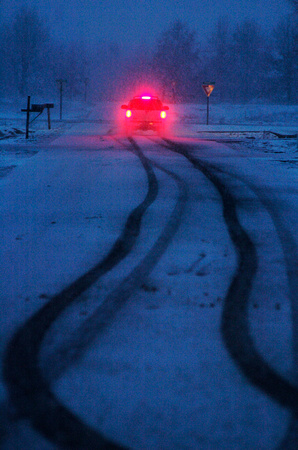 Don Campbell / H-P staff
A car weaves its way down Wentworth Drive in Mattawan during Thursday night's snowstorm.