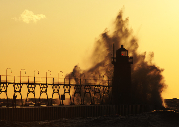 Waves crash into the South Haven Lighthouse October 15, 2011.